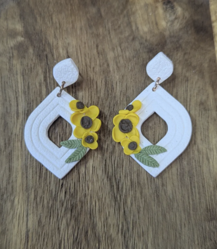 White tear drop earrings with yellow flowers